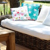 Wooden sofa in white and cushion with stars motif