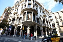 View of tourists on road near Hotel Casa Fuster at Barcelona, Spain