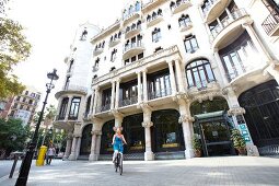 View of tourists on road near Hotel Casa Fuster at Barcelona, Spain