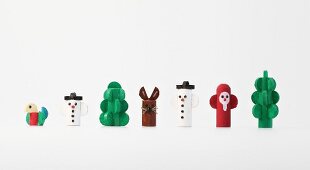 Colourful wooden figures on white background