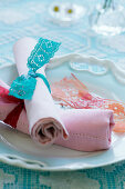 Napkins tied with lace ribbons