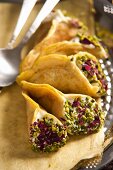 Quataif with pistachios (filled crepe pouches, Arabia)