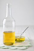 Vinegar in a bottle and in a glass bowl