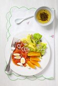 Salmon salad with egg, celery and oranges