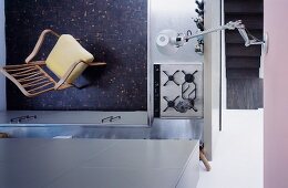 View of a kitchen gas oven and armchair in 50s style