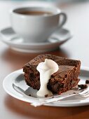A brownie with cream