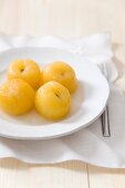 Steamed apricots on a plate