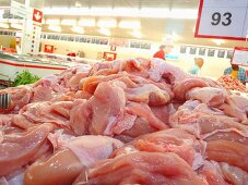 A pile of fresh chicken breast in a supermarket in Thailand