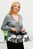 A woman holding Christmas gift bags