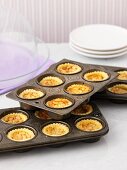 Mini butter tarts in a baking tin