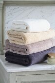 Stack of towels on bathroom cupboard