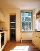 Rustic kitchen with old floorboards and modern kitchen equipment