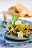 Marinated courgettes with feta cheese, oranges and basil