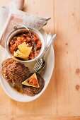 Mexican minced meat steaks with a bean medley