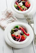 Greek salad made with feta cheese, cucumbers, peppers, tomatoes and olives