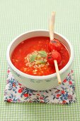 Cream of tomato soup with rice, lemongrass, cherry tomatoes and mint