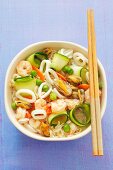 Noodle soup with prawns, squid, mussels and courgettes (Asia)