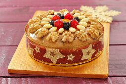 A fruit cake with almonds and walnuts