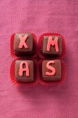Christmas pralines decorated with letters