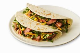 Two Beef Soft Tacos on a White Plate; White Background