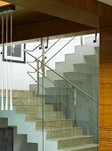 Glass stairwell with metal handrail