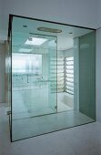 Bathroom with glass shower cubicle & sunken bathtub