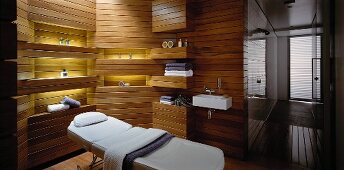 Spa & massage room with wood panelling