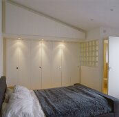 Bedroom with double bed & fitted wardrobes