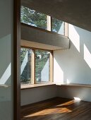 Empty living space with double-height ceiling