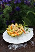 Avocado and prawn salad in hollowed-out musk melon