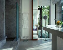 Designer bathroom with marble shower area