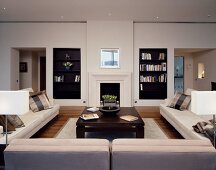 Living room with upholstered seating and fitted bookcases