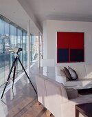 Telescope in living room of penthouse apartment