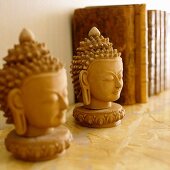 Plaster Buddha's heads on shelf