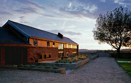 View of long house at dusk