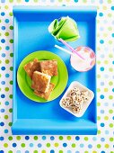 Pineapple cake, crispy fruit bowls with puffed rice and a milkshake