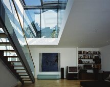 Stairs under ceiling cutout in modern living space