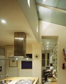Kitchen with island and extractor hood