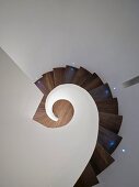Top view of stairwell with wooden spiral staircase