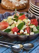 A summer salad with melon, mint, feta and pomegranate
