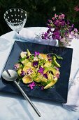 Avocado salad with rocket and edible flowers