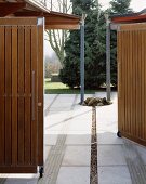 Open garden gate and view of garden