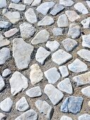 Pebbles pressed into sand