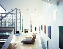 Staircase and pictures on wall in spacious living room