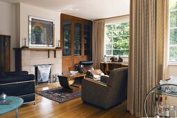 View of living room with armchairs and couch