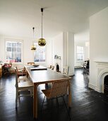 Mix of furnishing styles in living-dining room of spacious London apartment in old building