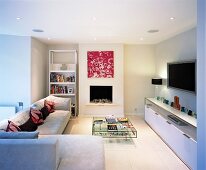 Contemporary fireplace with sofas and elegant sideboard