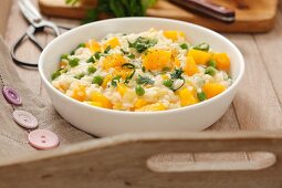 Risotto with pumpkin, peas and parsley