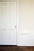 White-painted, panelled interior door
