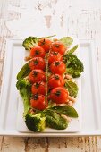 Roast tomatoes on bean and broccoli salad